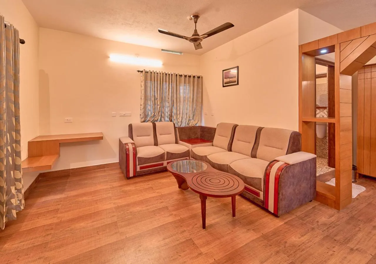 Living room in Ushasree Wayanad Premium Pool Resort by VOYE HOMES