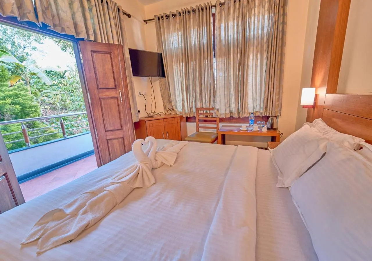 Bed in Ushasree Wayanad Premium Pool Resort by VOYE HOMES