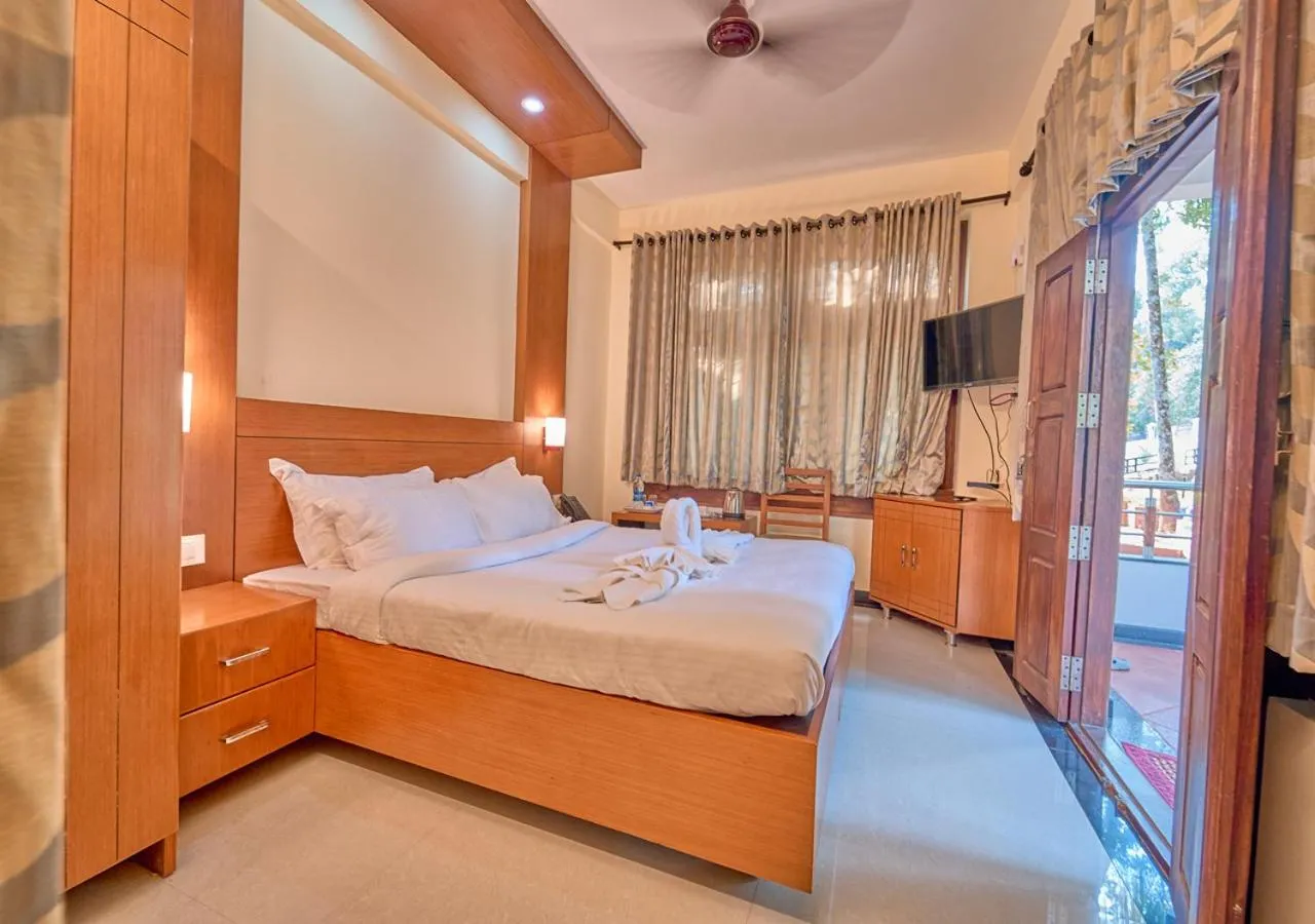 Bed in Ushasree Wayanad Premium Pool Resort by VOYE HOMES