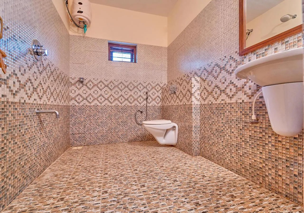 Shower in Ushasree Wayanad Premium Pool Resort by VOYE HOMES