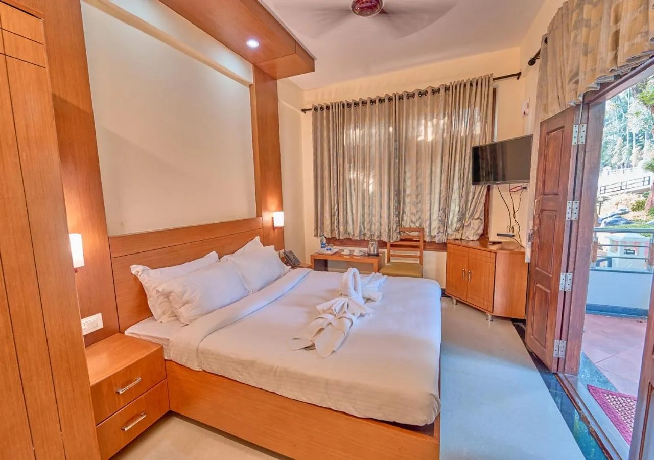 Bed in Ushasree Wayanad Premium Pool Resort by VOYE HOMES