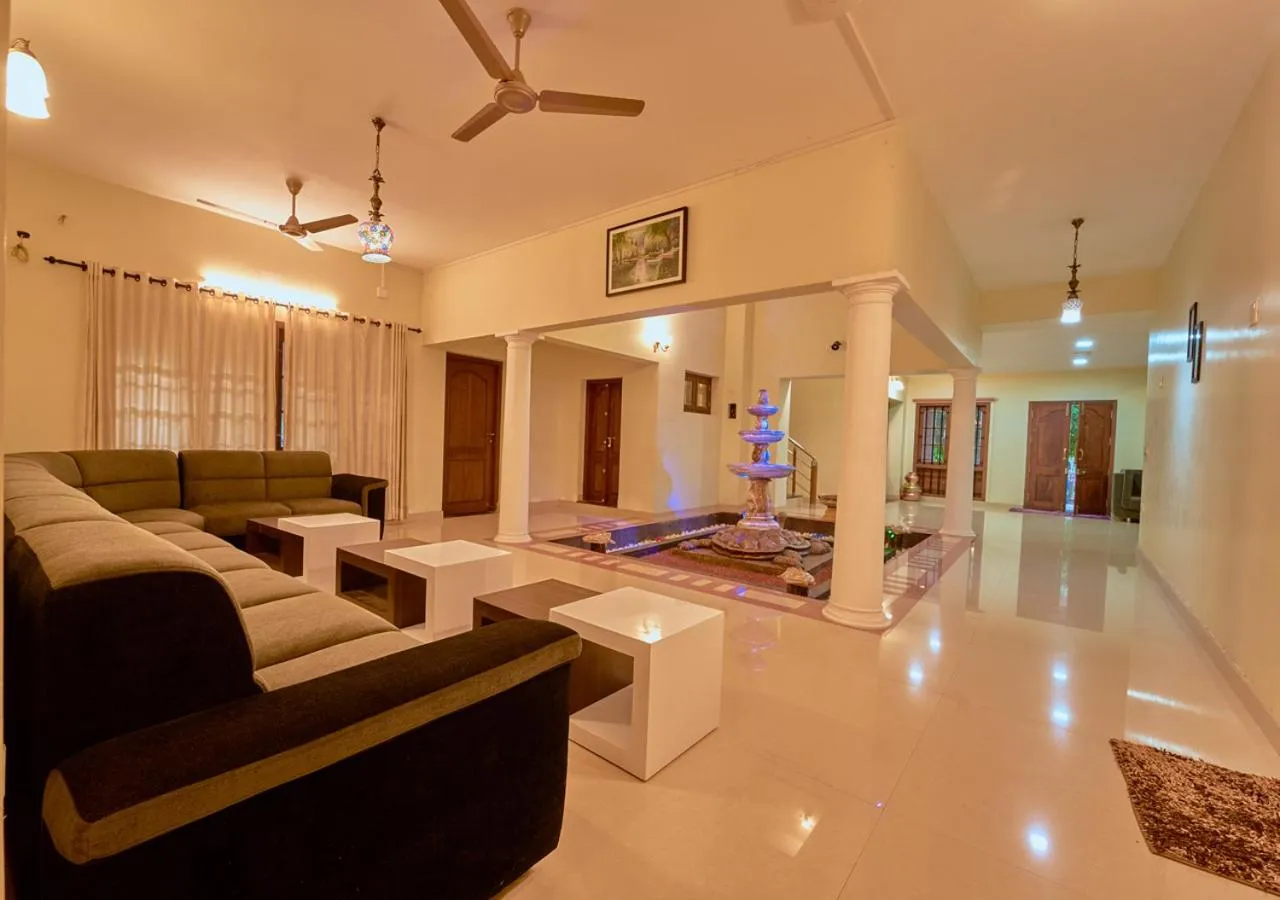 TV and multimedia in Ushasree Wayanad Premium Pool Resort by VOYE HOMES