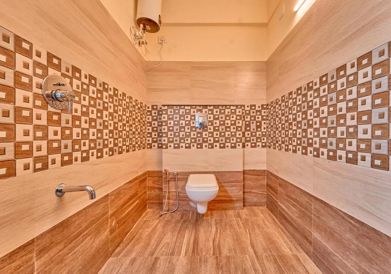 Shower in Ushasree Wayanad Premium Pool Resort by VOYE HOMES
