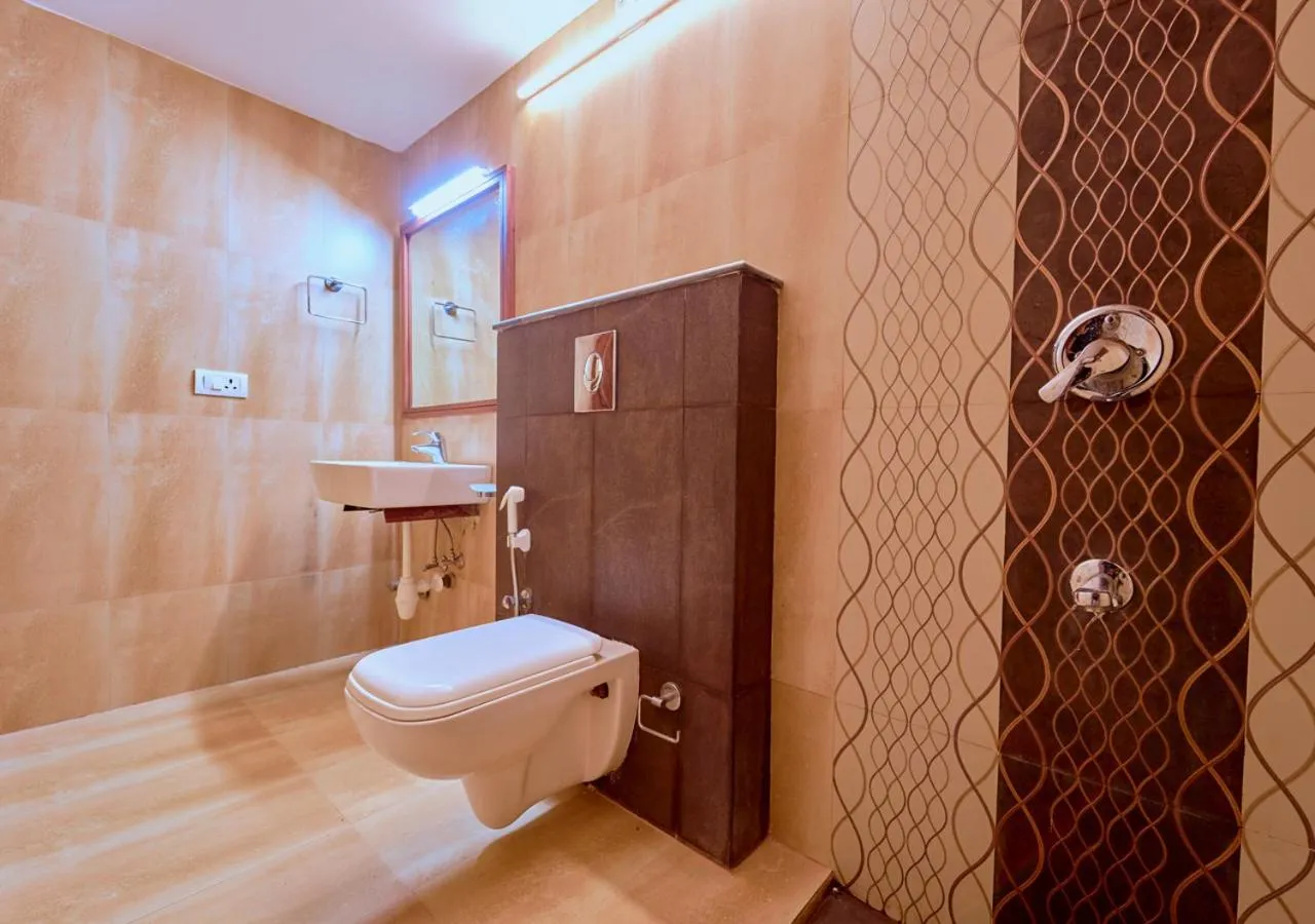 Shower in Ushasree Wayanad Premium Pool Resort by VOYE HOMES