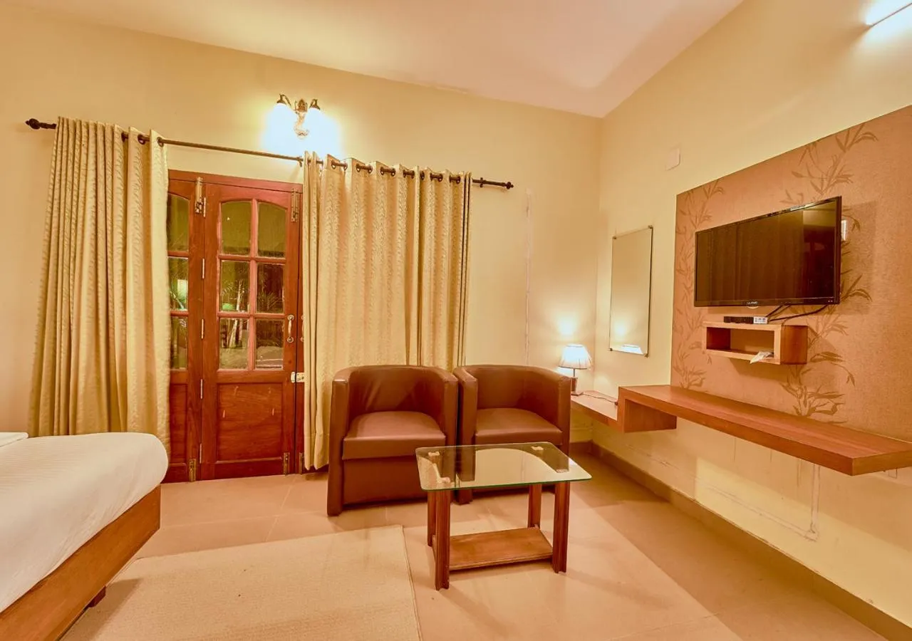 TV and multimedia, Bed in Ushasree Wayanad Premium Pool Resort by VOYE HOMES