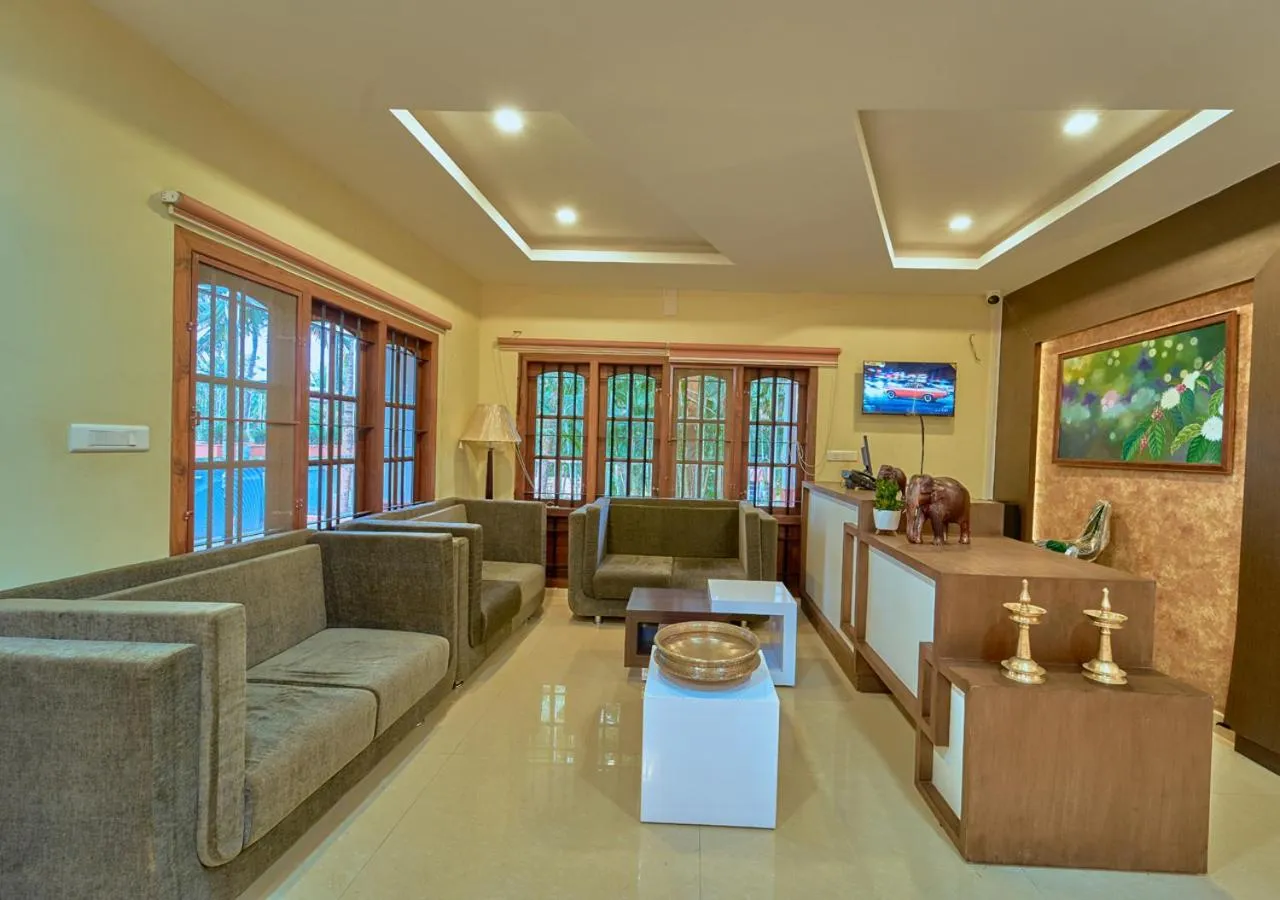TV and multimedia in Ushasree Wayanad Premium Pool Resort by VOYE HOMES