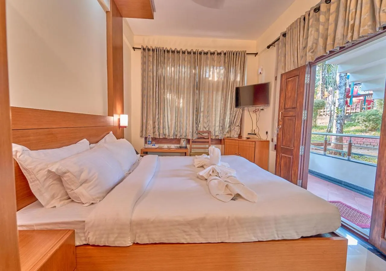 Bed in Ushasree Wayanad Premium Pool Resort by VOYE HOMES
