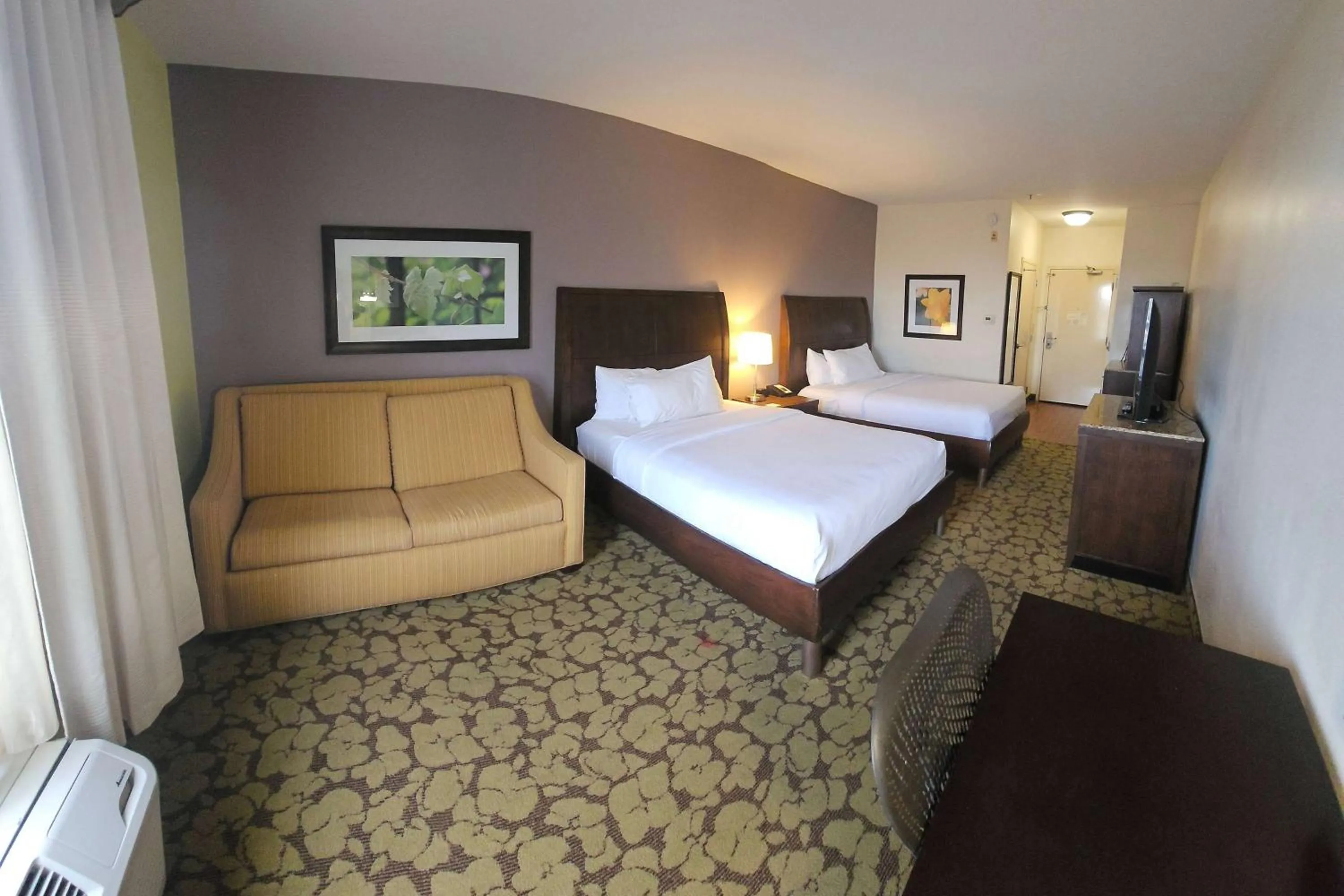 Photo of the whole room, Bed in Wyndham Garden New Orleans Airport