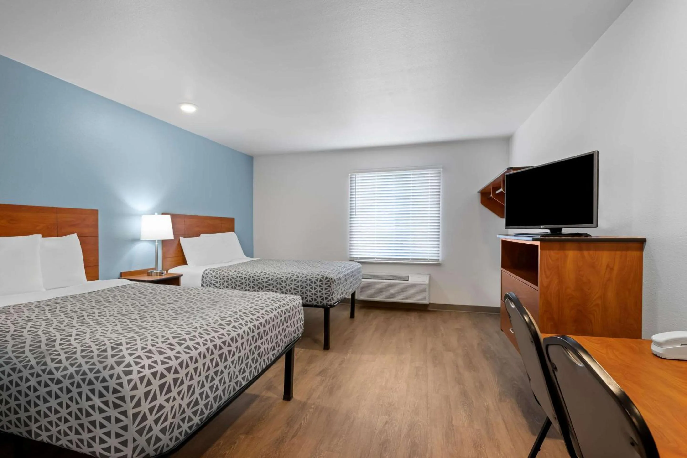 Bedroom, Bed in WoodSpring Suites Hobbs