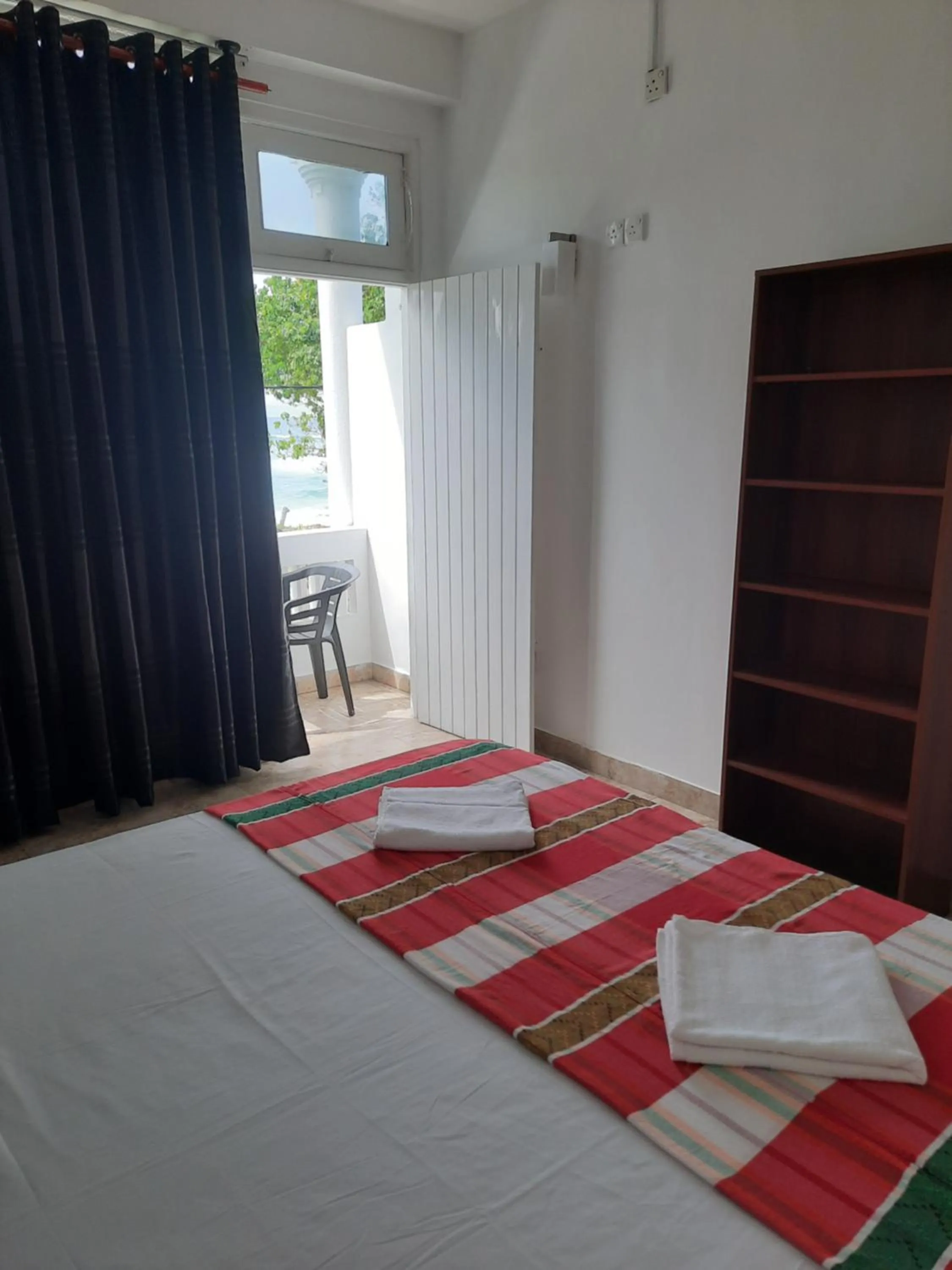 Bed in White Surfing Beach Resort