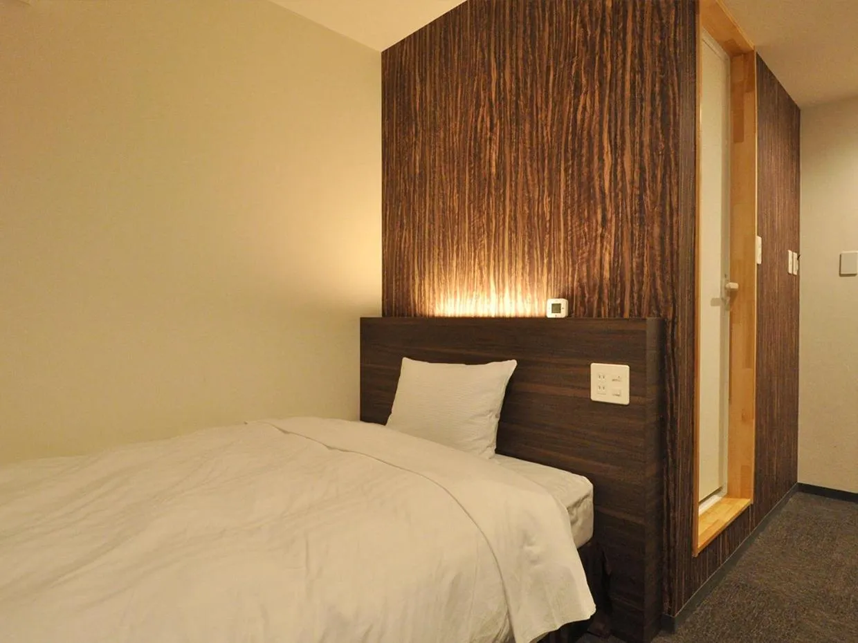 Bed in Business Hotel Atelier
