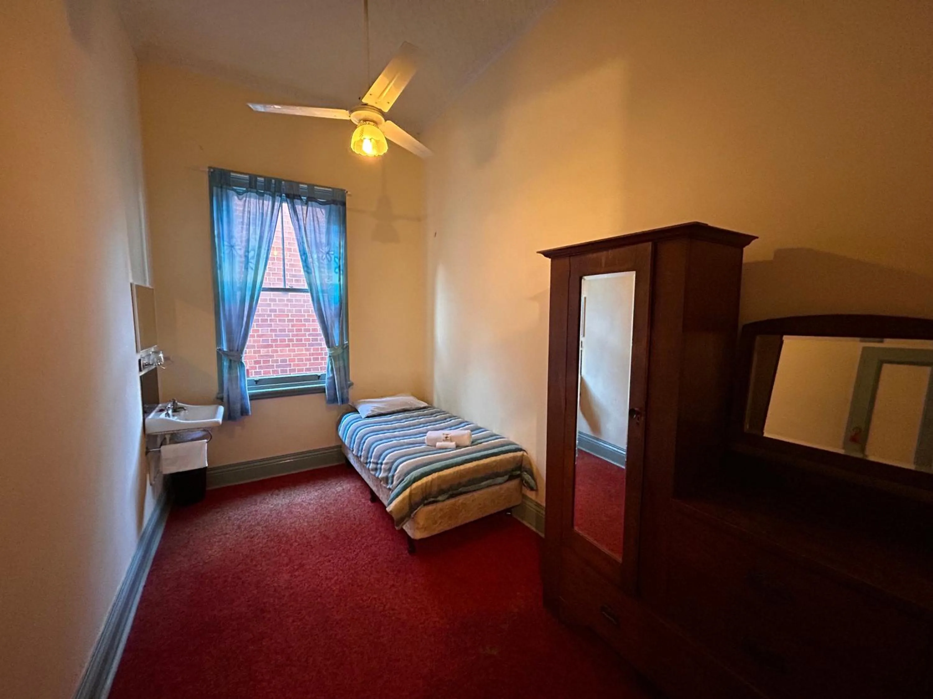 Bed in Criterion Warwick Hotel