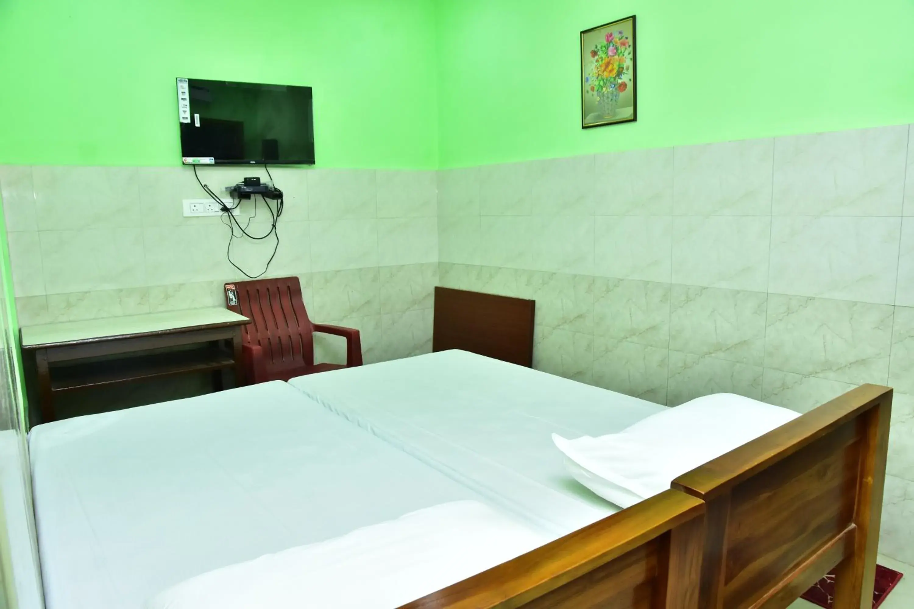 TV and multimedia, Bed in Sri Tirumalaa Hotel TV and multimedia, Bed in Sri Tirumalaa Hotel