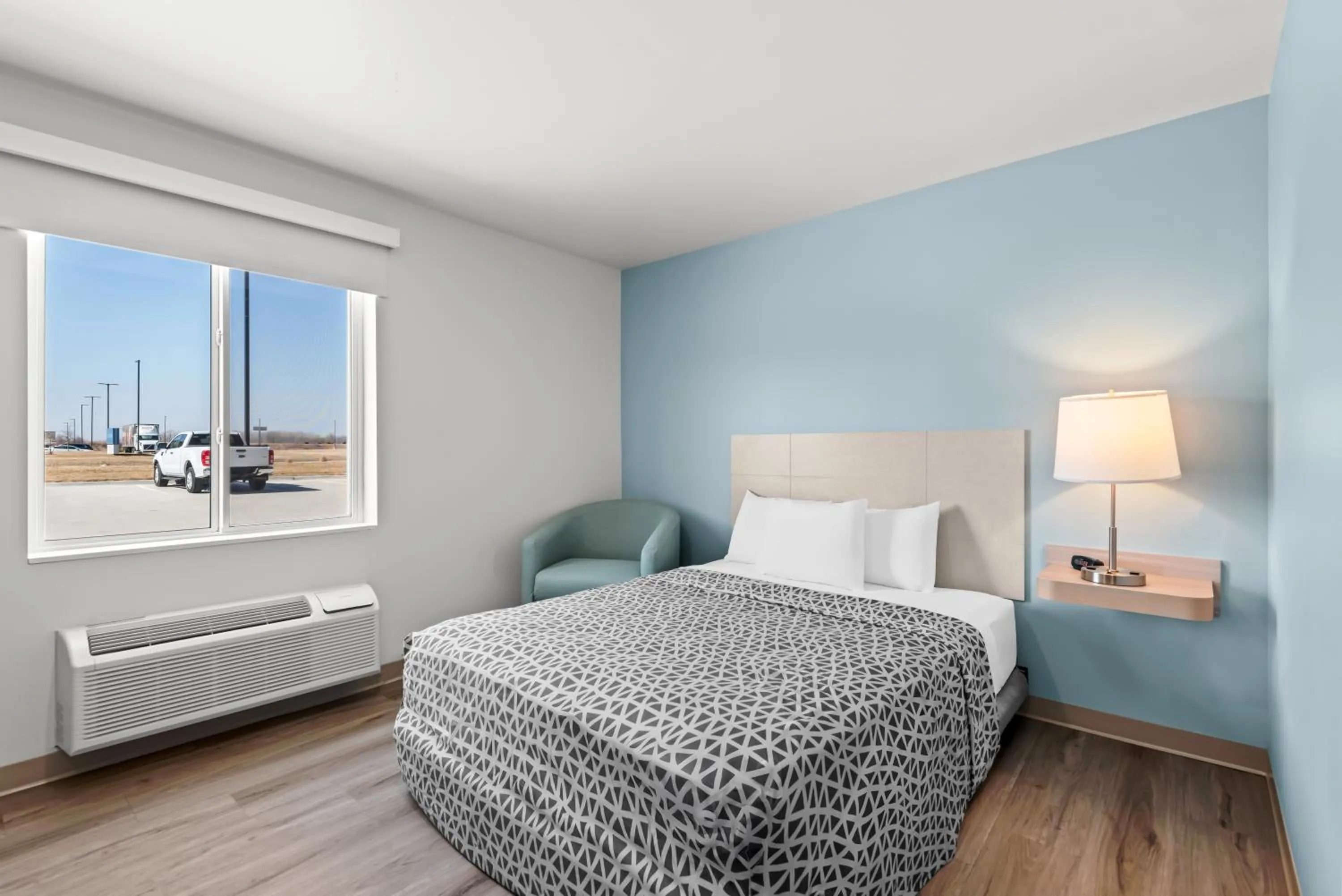 Bedroom, Bed in WoodSpring Suites Coralville Iowa City