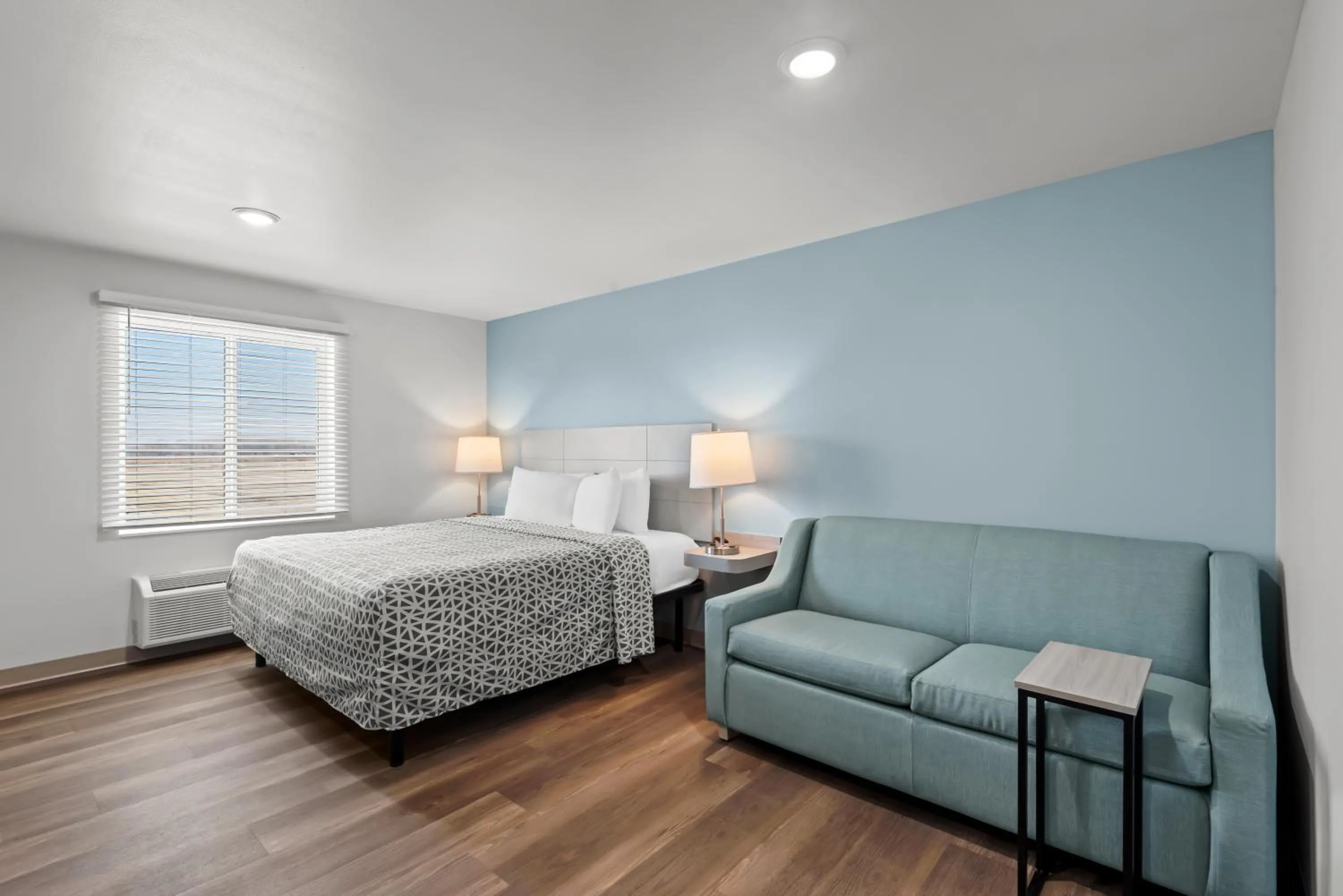 Bedroom, Bed in WoodSpring Suites Coralville Iowa City