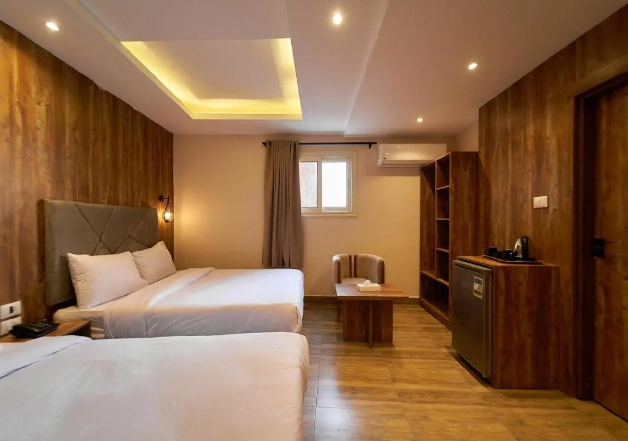 Bed in Crown Pyramids View Hotel