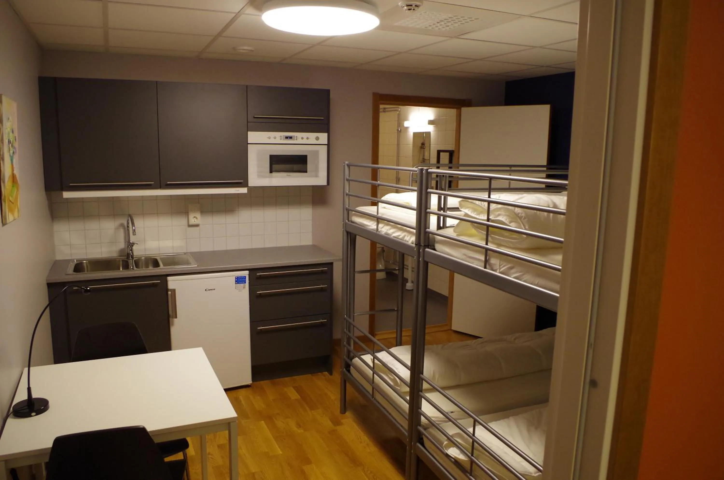 Kitchen or kitchenette in Spoton Hostel & Sportsbar