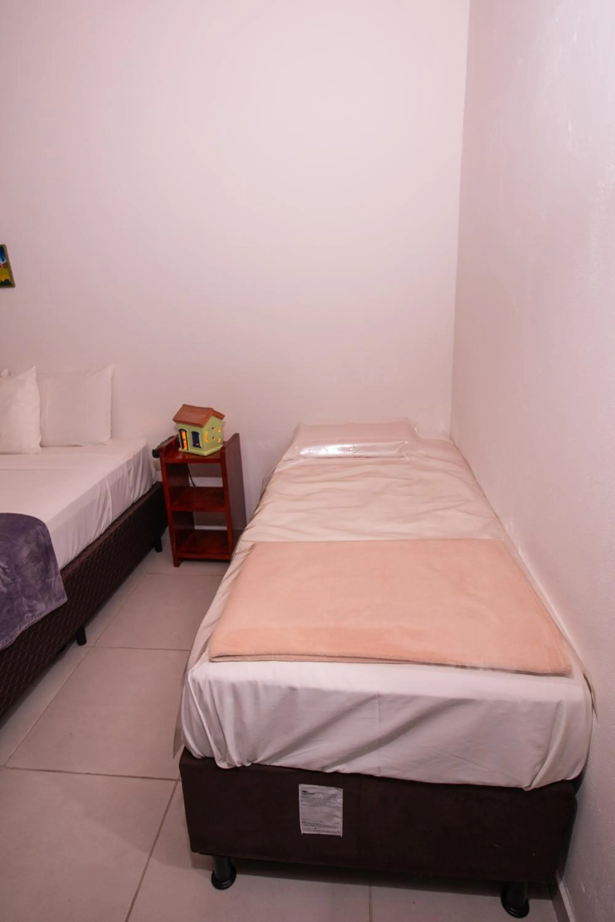 Bed in Pousada do Mineiro