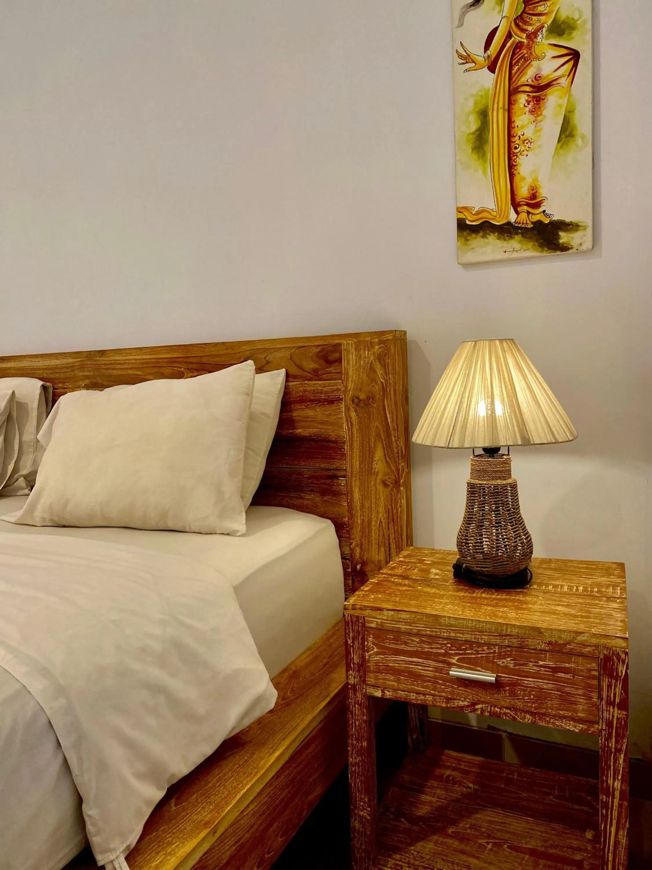 Bed in Uma Sindu Homestay