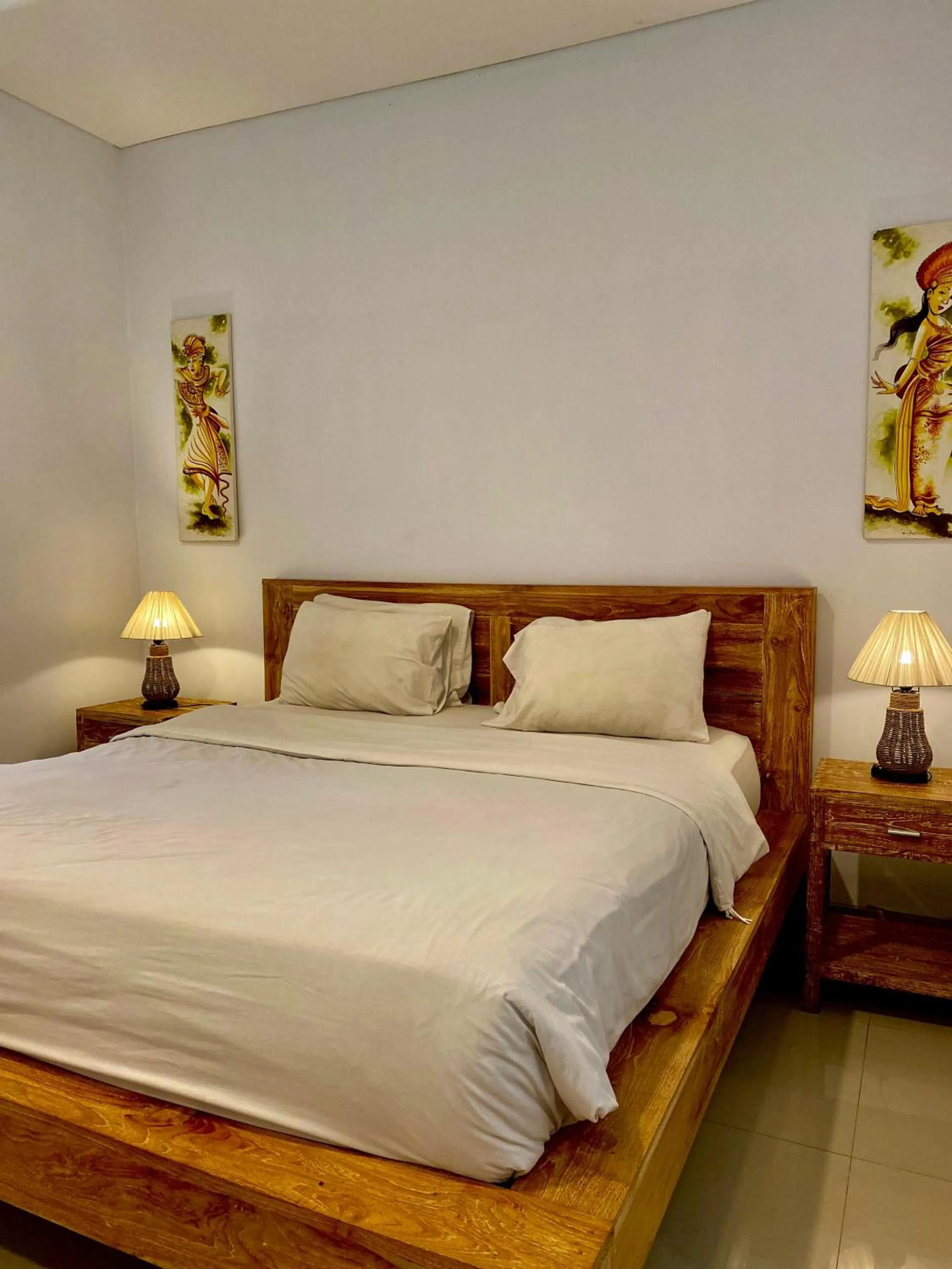 Bed in Uma Sindu Homestay