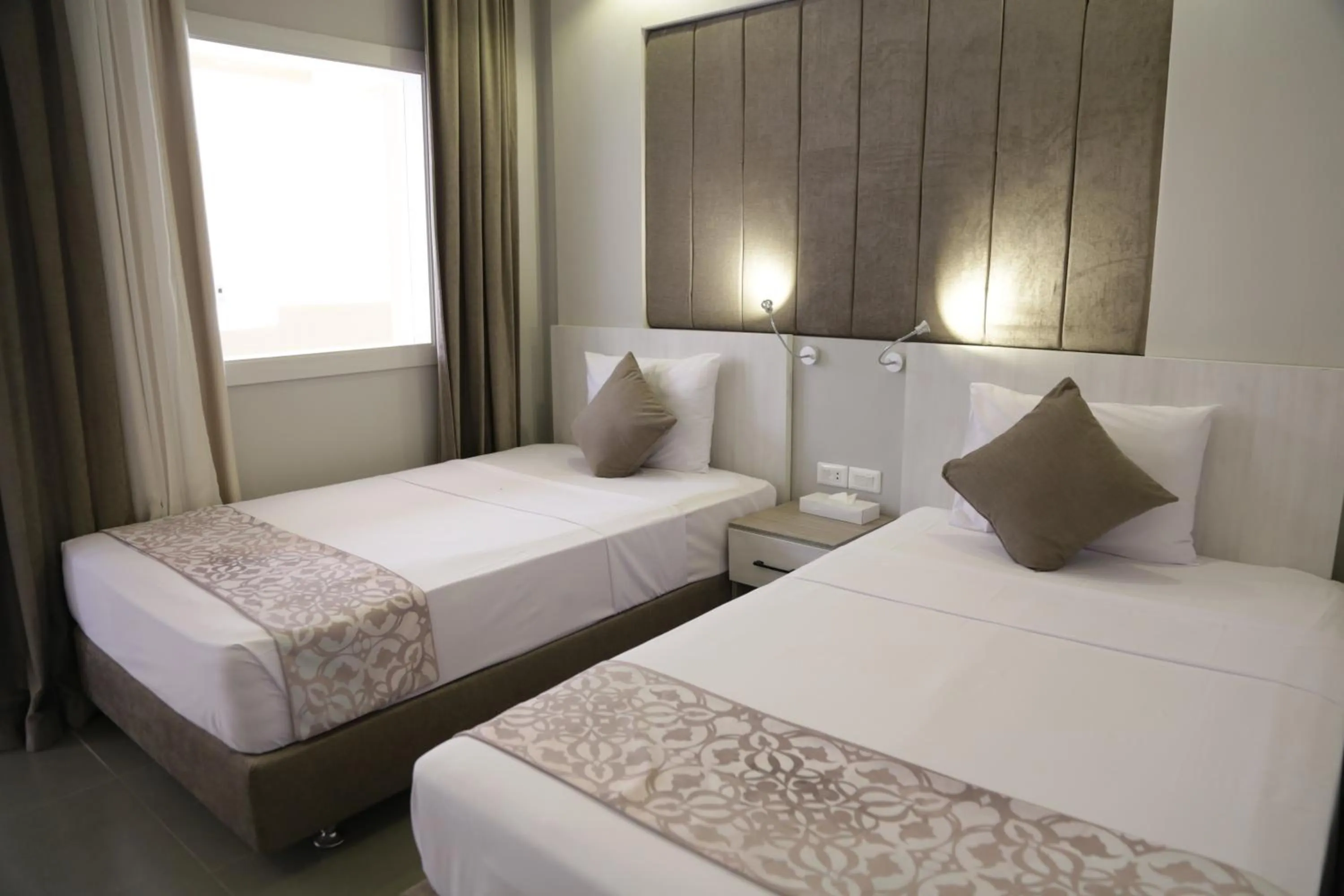 Photo of the whole room, Bed in Aladdin Beach Resort