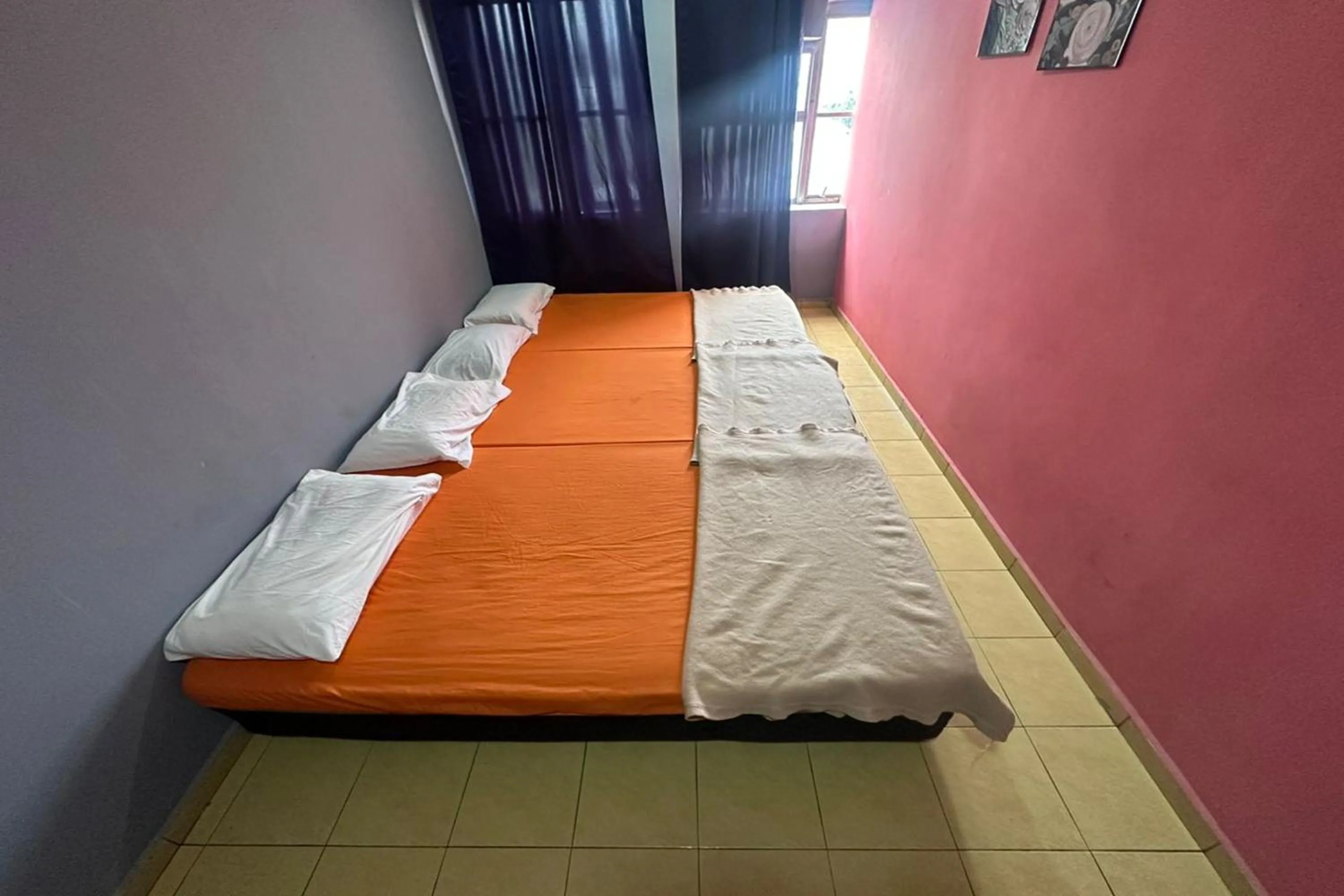 Bed in I Rose Budget Hotel