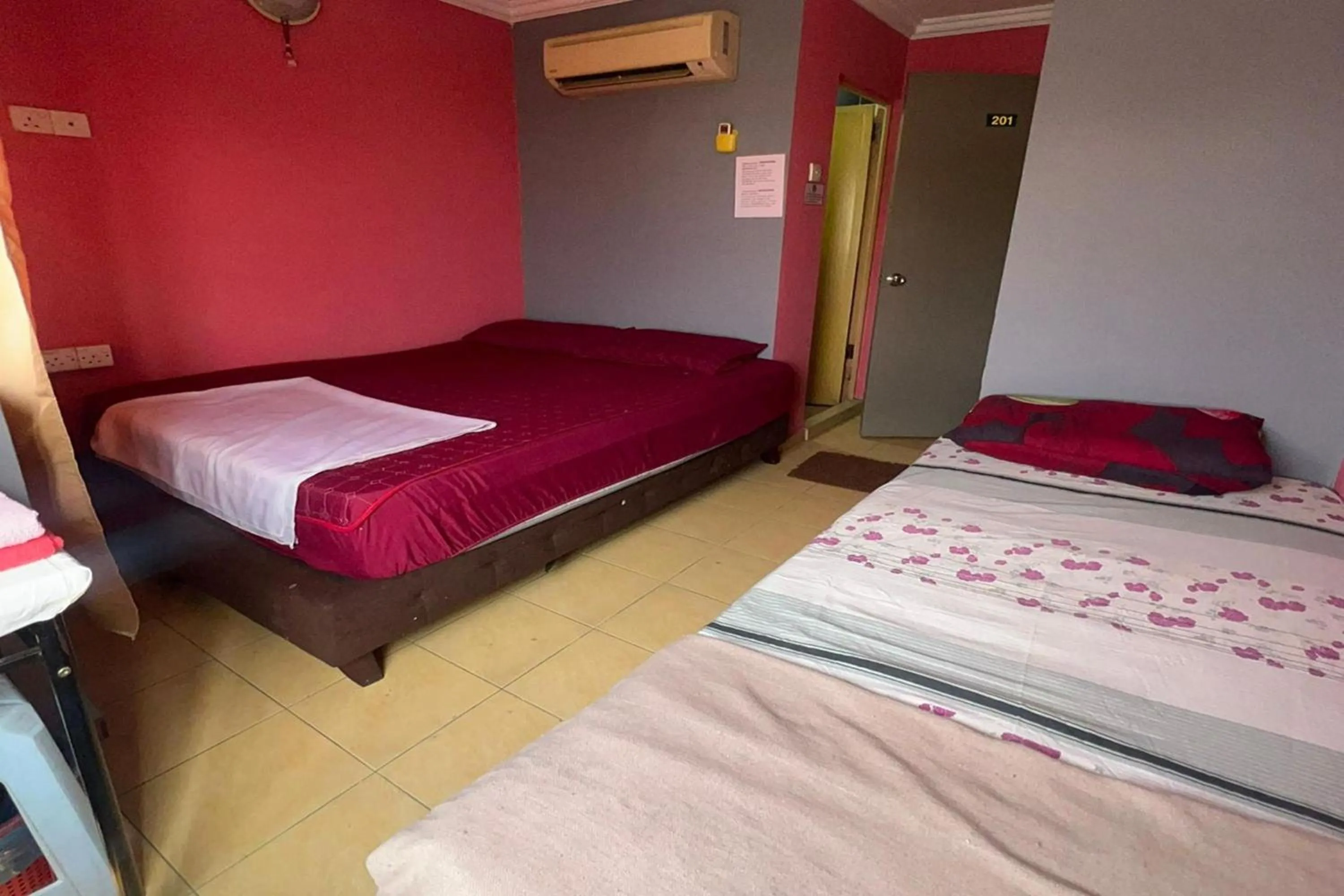 Bed in I Rose Budget Hotel