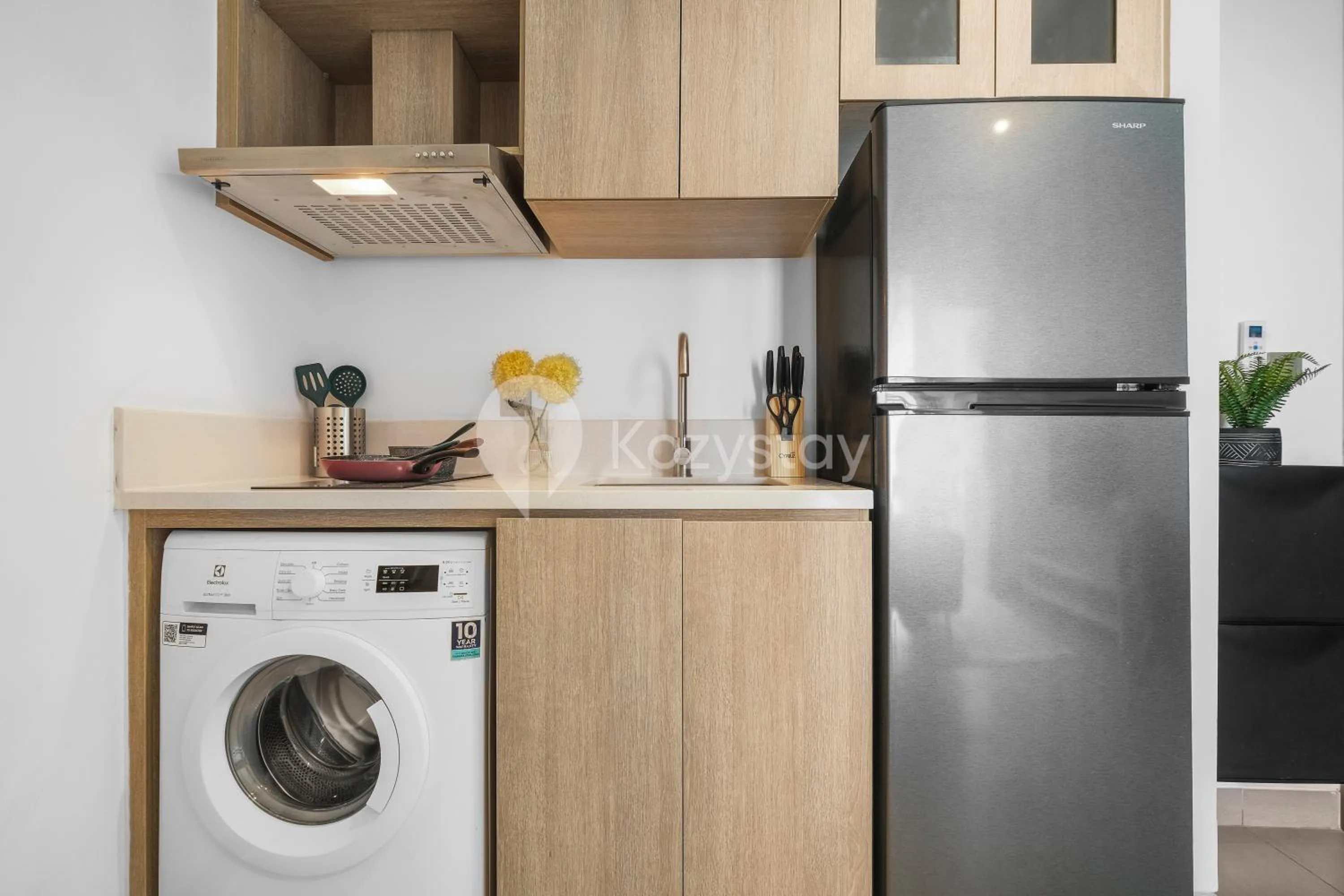 Kitchen or kitchenette in Serica by Kozystay - Fatmawati