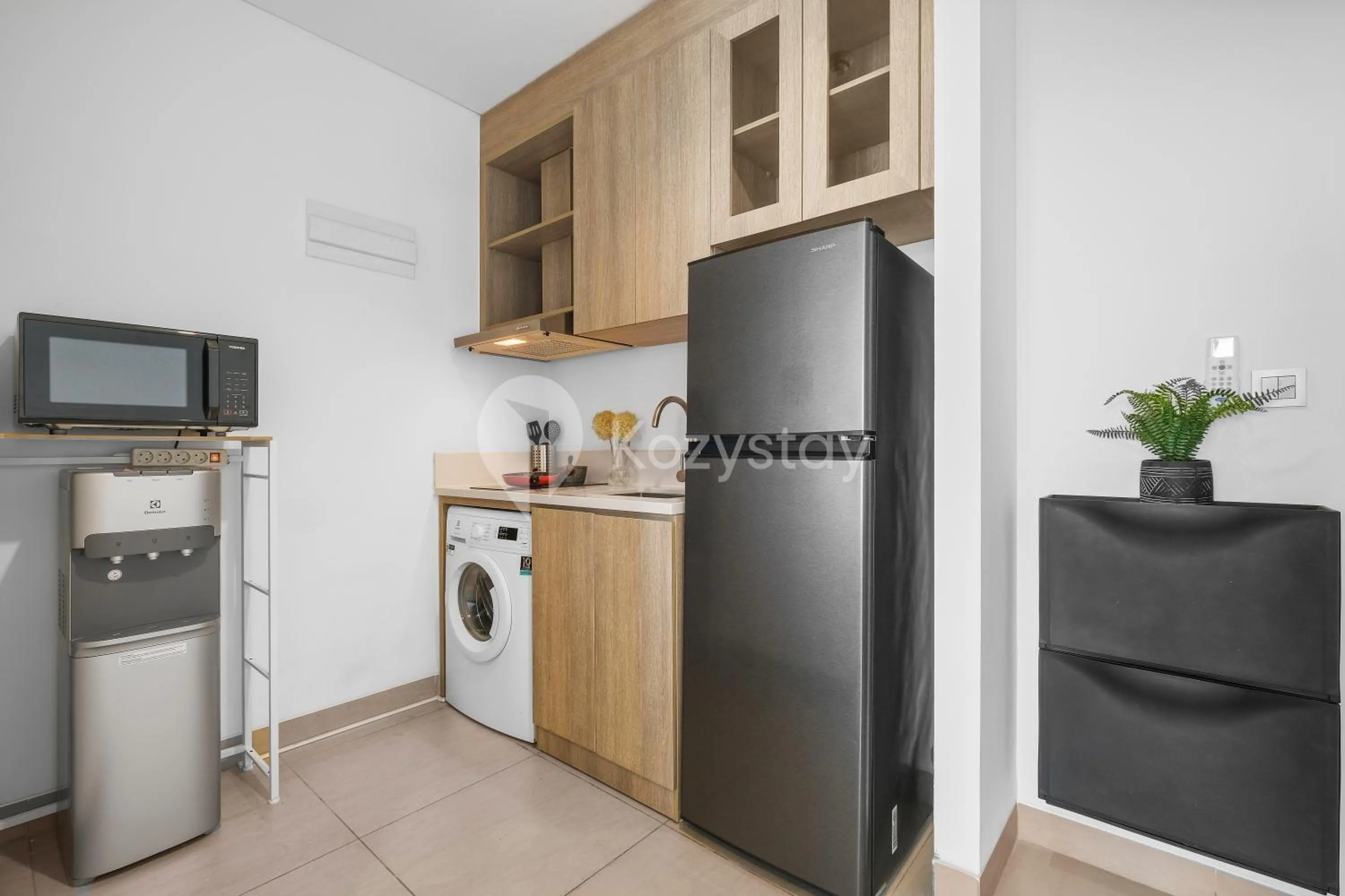 Kitchen or kitchenette in Serica by Kozystay - Fatmawati