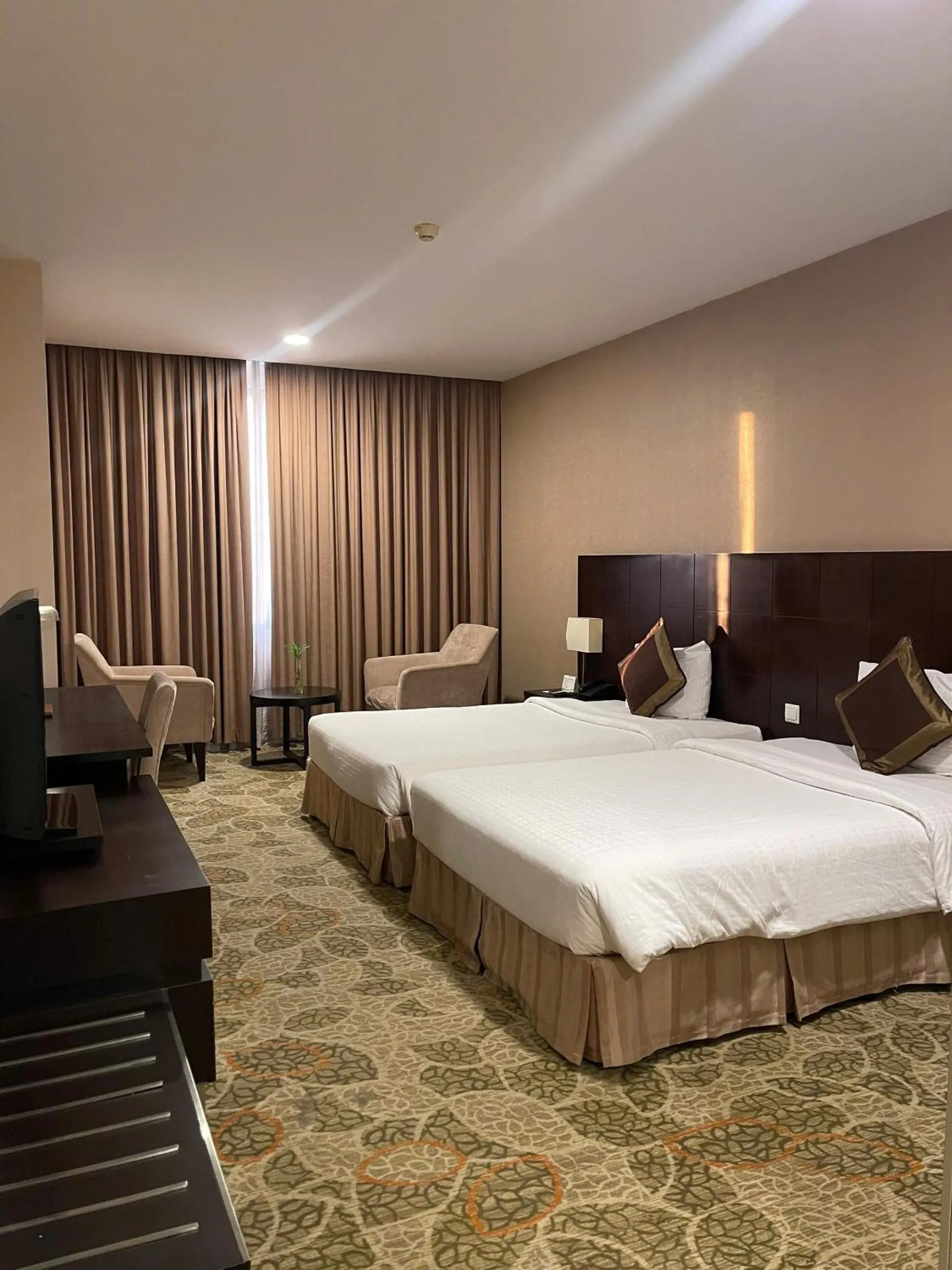 Bed in AURORA Hotel Plaza