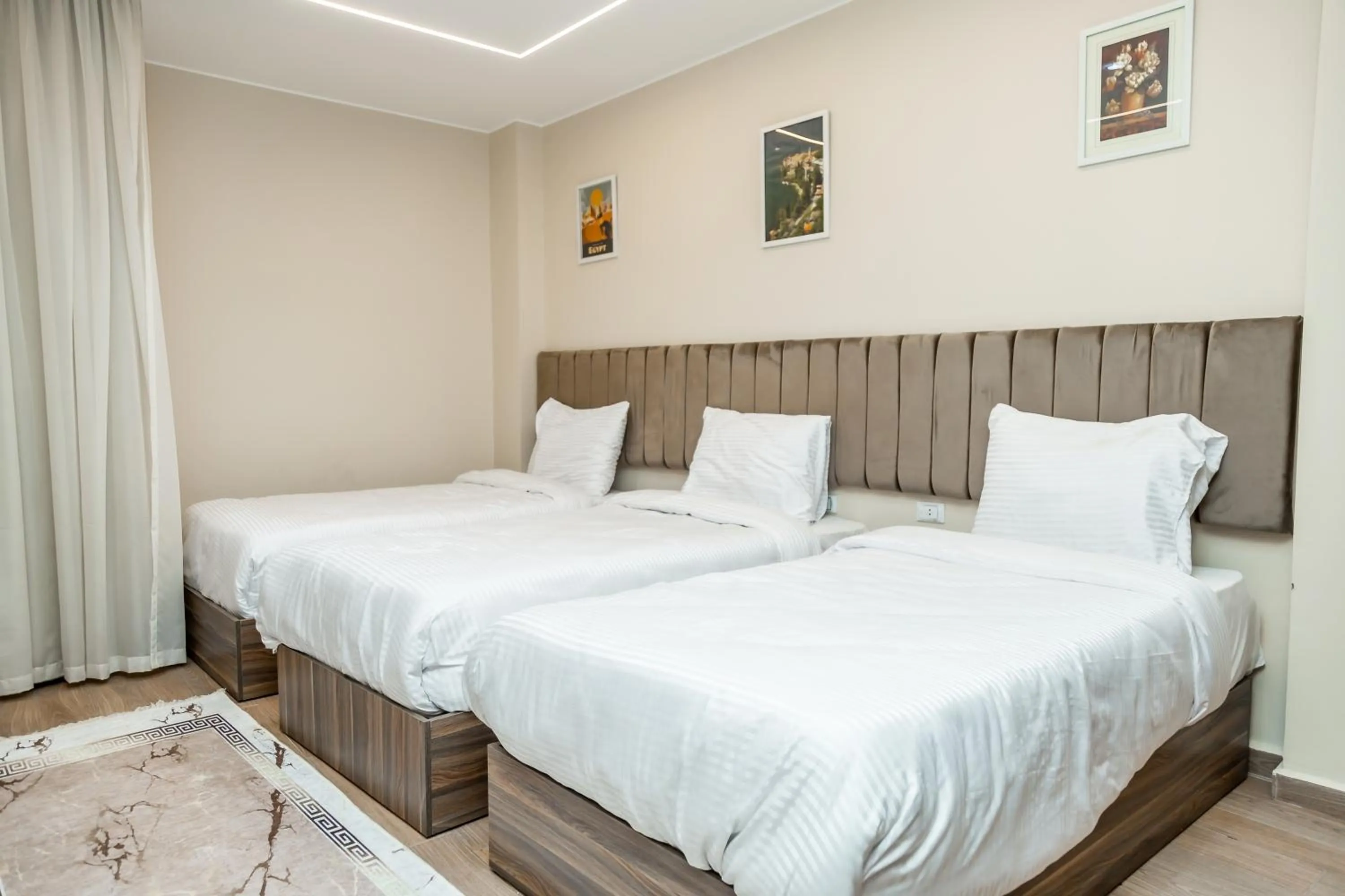 Bed in Night Pyramids Inn Hotel