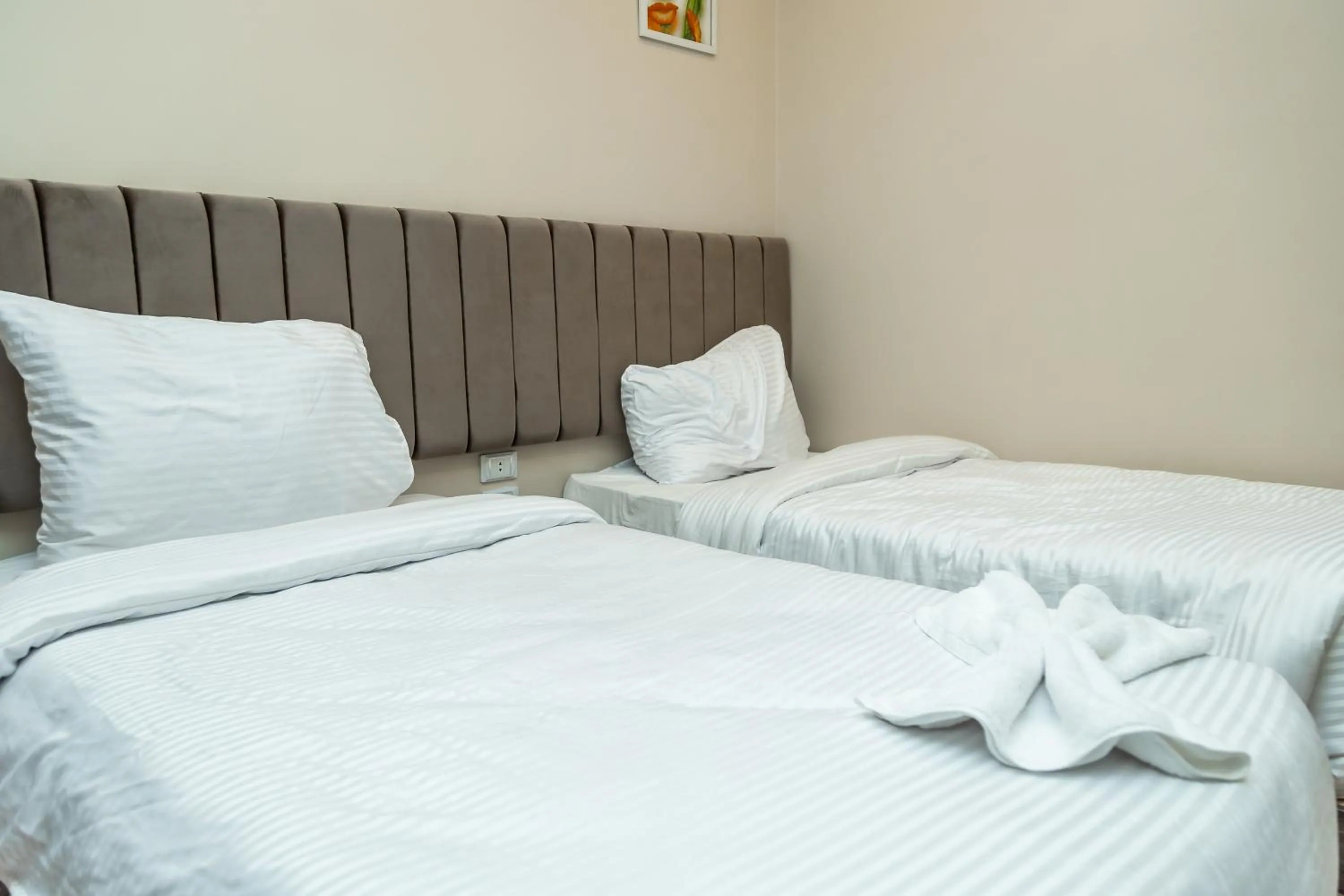 Bed in Night Pyramids Inn Hotel