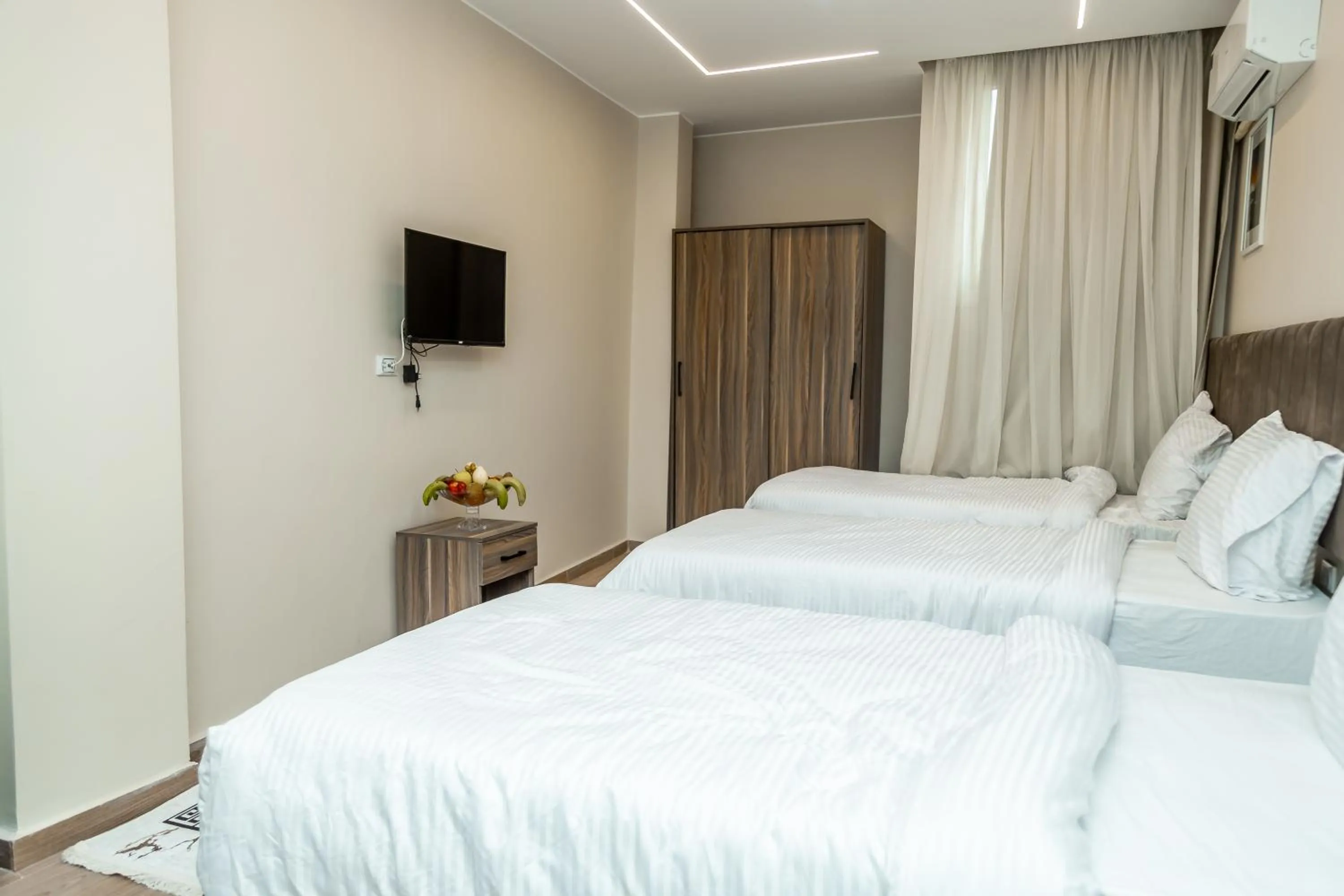 Bed in Night Pyramids Inn Hotel