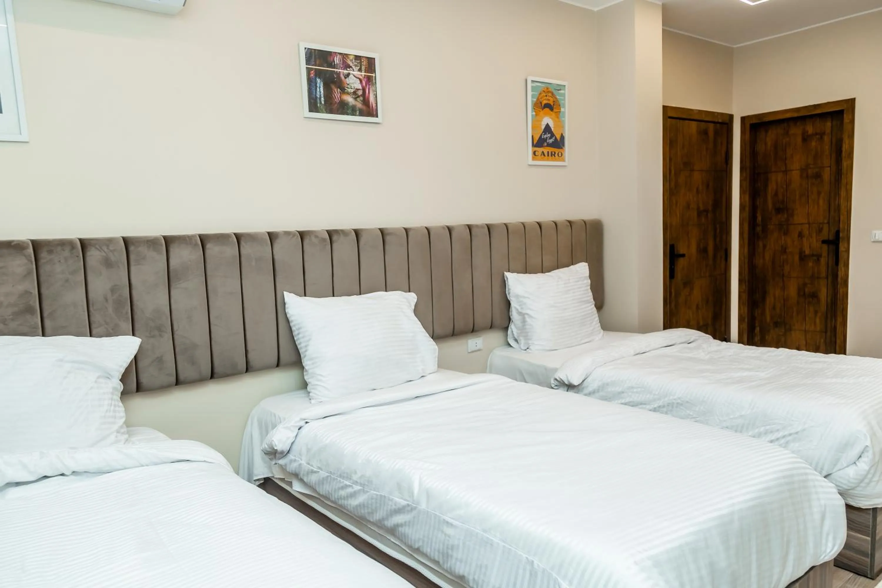 Bed in Night Pyramids Inn Hotel