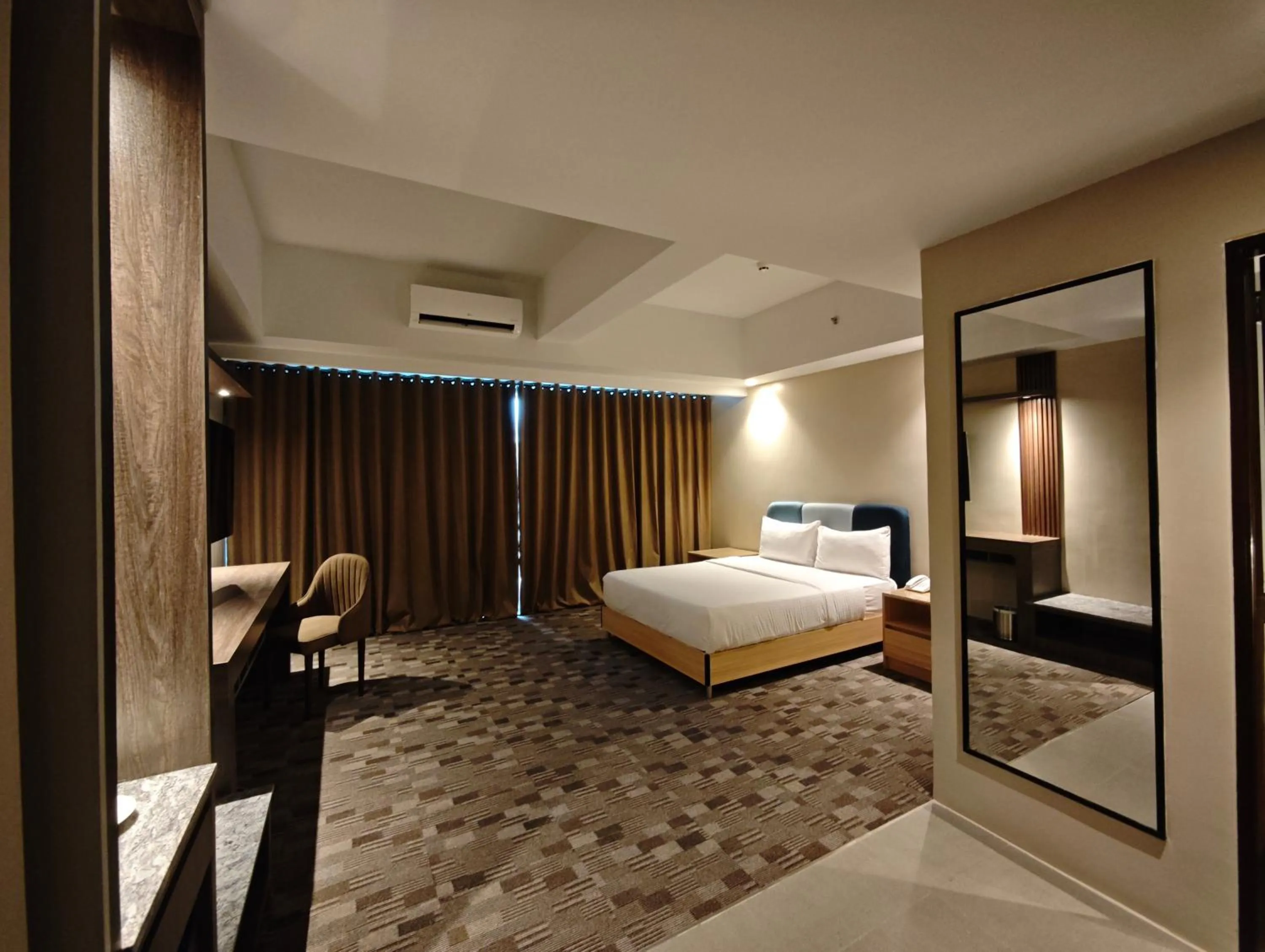 Bed in The Tribute Hotel