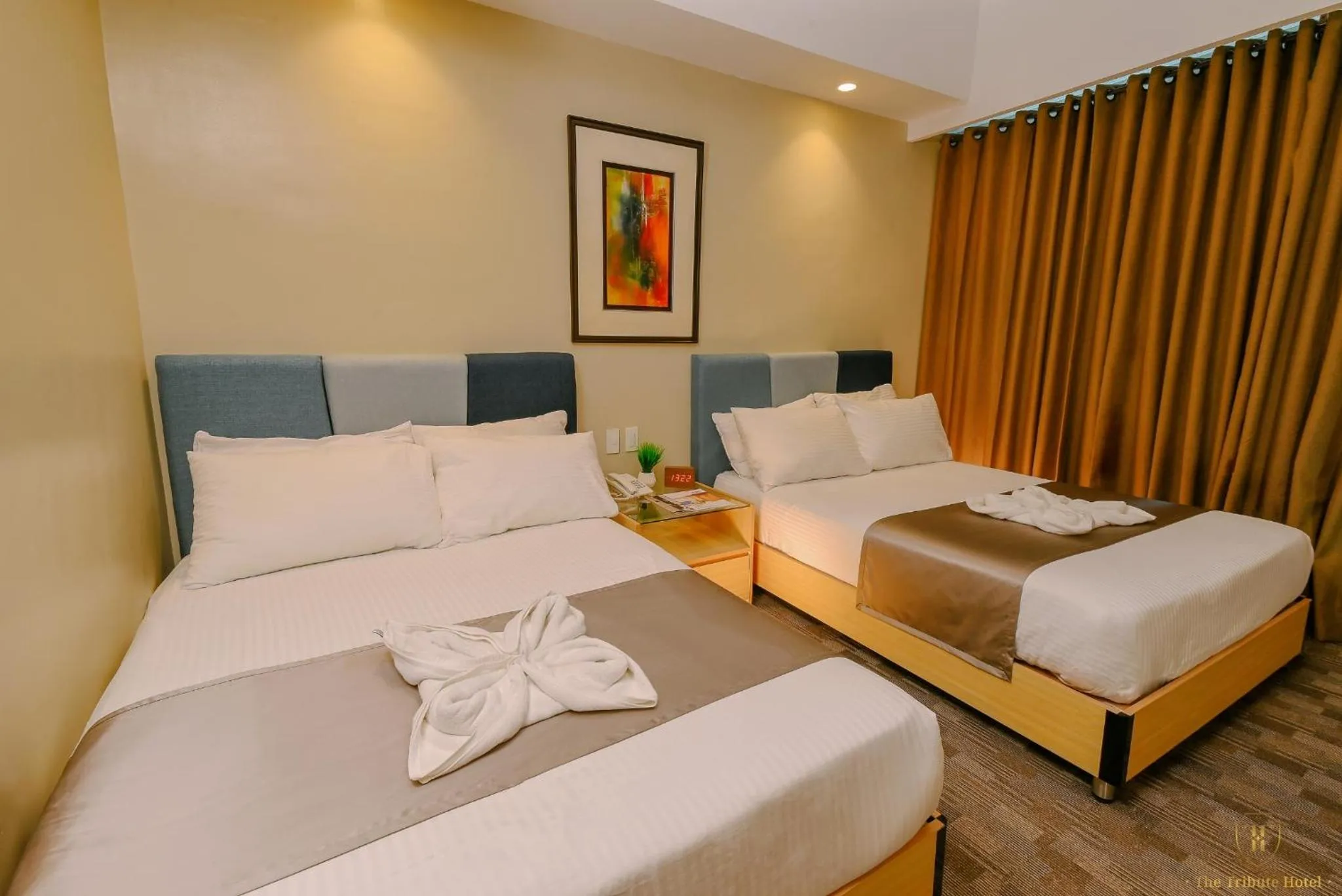 Bed in The Tribute Hotel