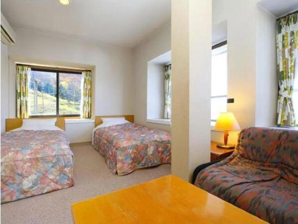 Bed in Ikenotaira Hotel