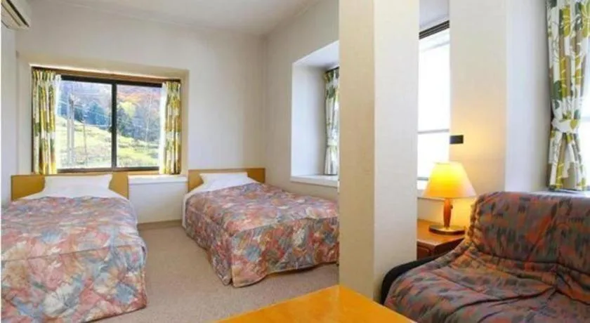 Bed in Ikenotaira Hotel