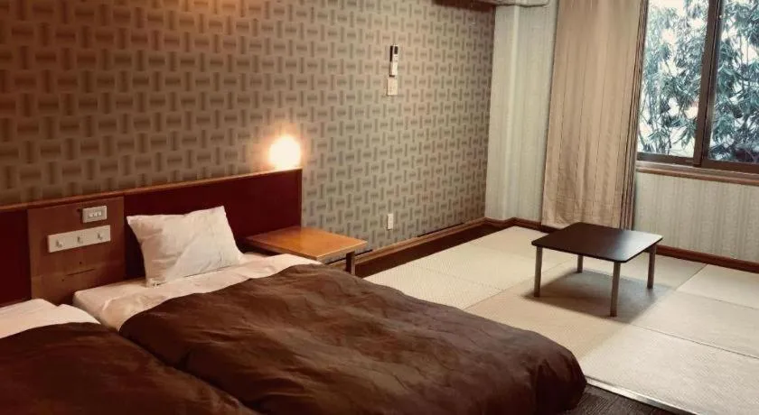 Bed in Ikenotaira Hotel