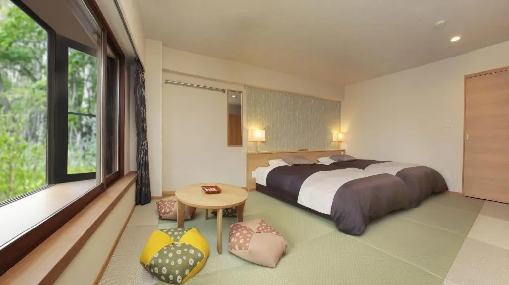 Bed in Ikenotaira Hotel