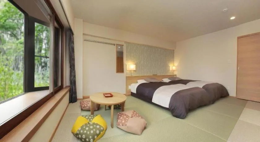 Bed in Ikenotaira Hotel