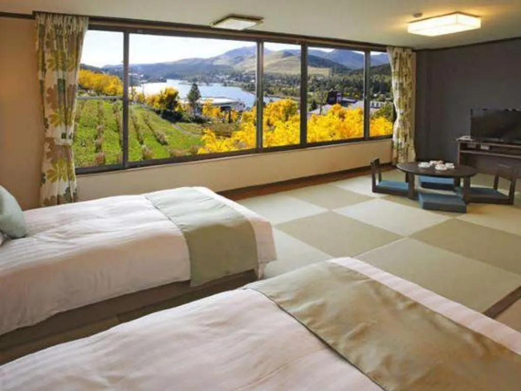 Bed in Ikenotaira Hotel