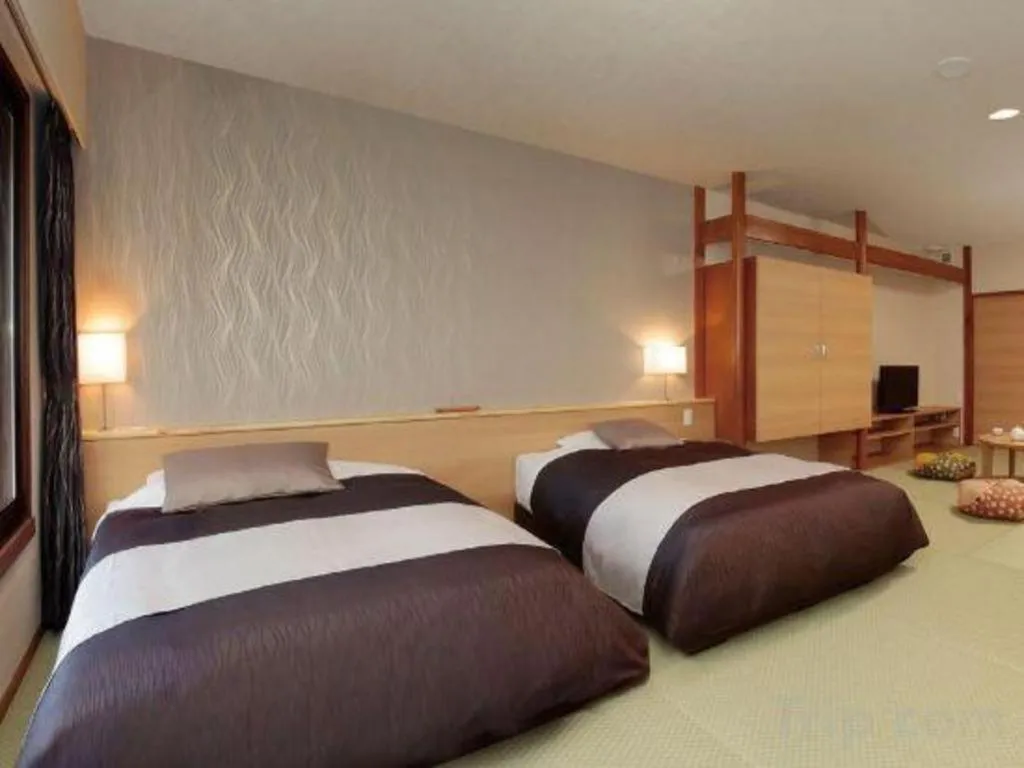 Bed in Ikenotaira Hotel