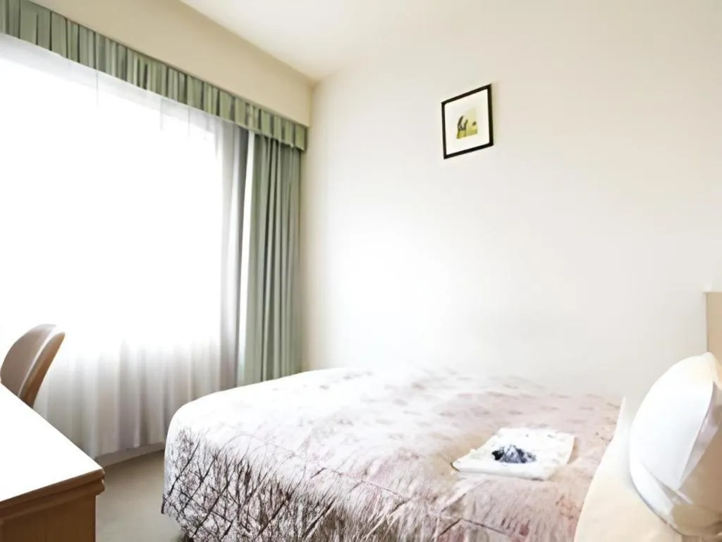 Bed in Pearl Hotel Ota