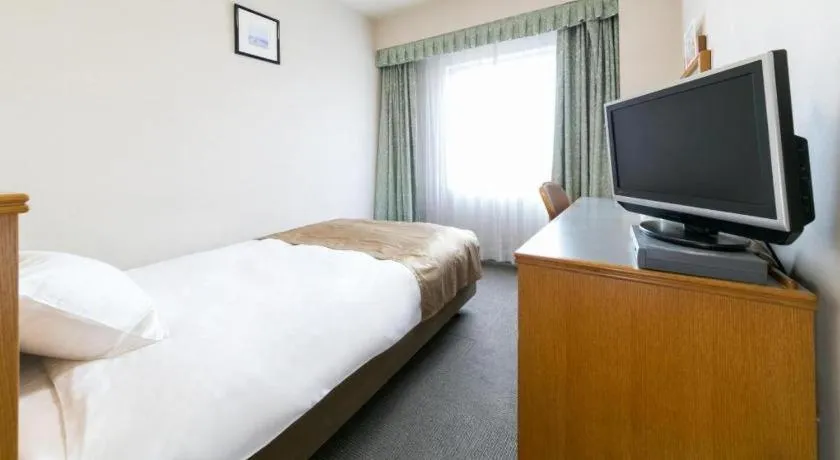 Bed in Pearl Hotel Ota