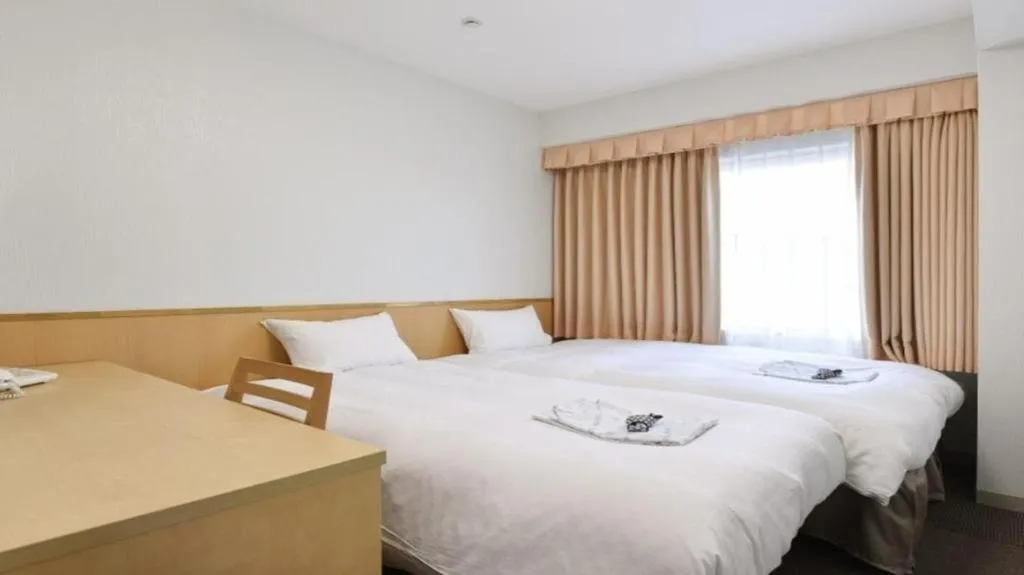 Bed in Pearl Hotel Ota