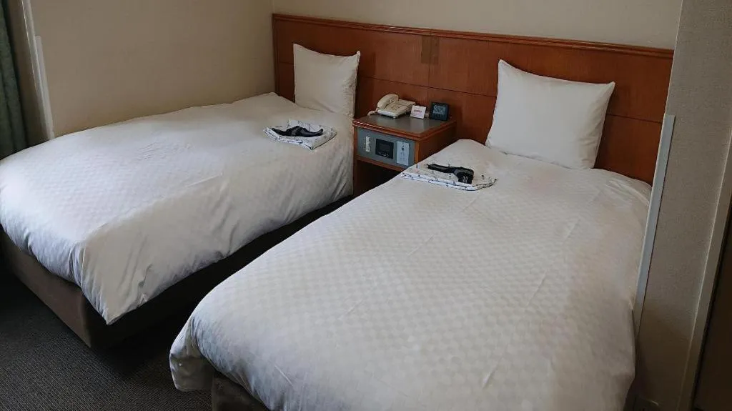 Bed in Pearl Hotel Ota