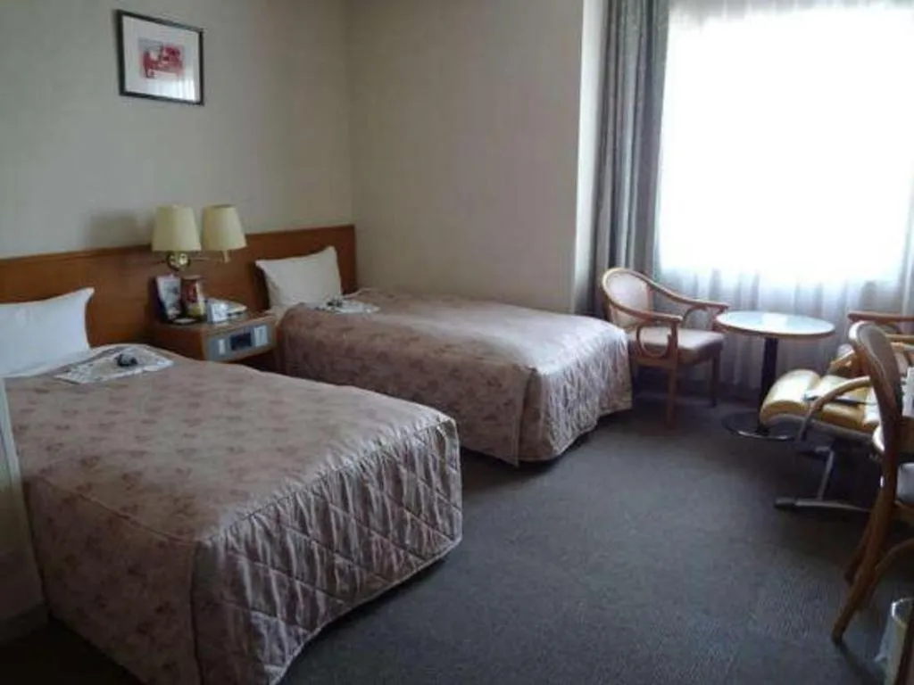 Bed in Pearl Hotel Ota