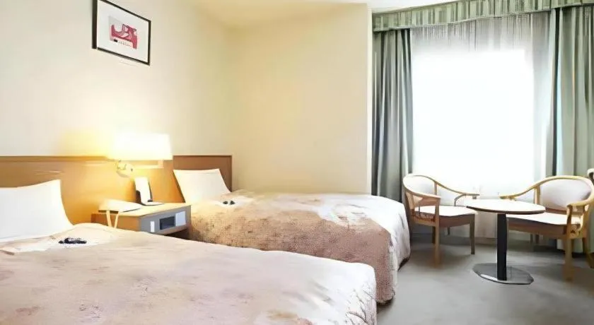 Bed in Pearl Hotel Ota