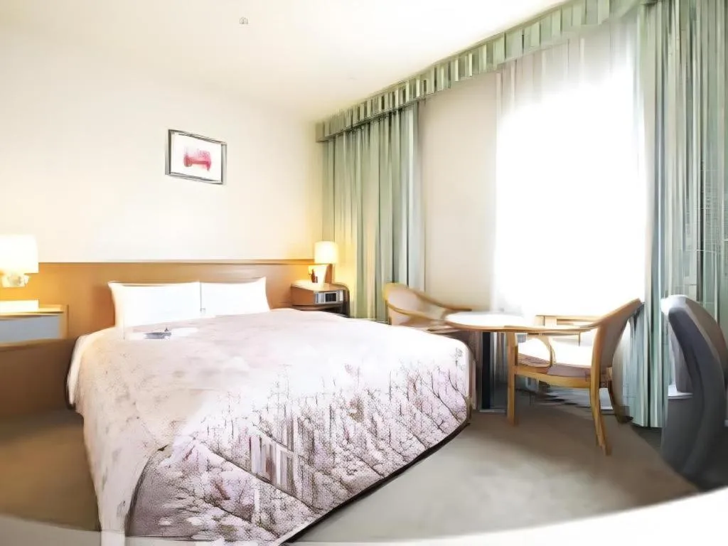 Bed in Pearl Hotel Ota